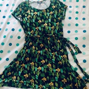 Jersey dress, cap sleeves with a tie waist.